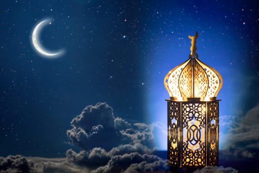Ornamental Arabic lantern with crescent moon glowing at night. Festive greeting card for Muslim holy month Ramadan Kareem.