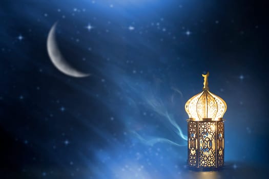 Ornamental Arabic lantern with crescent moon glowing at night. Festive greeting card for Muslim holy month Ramadan Kareem.
