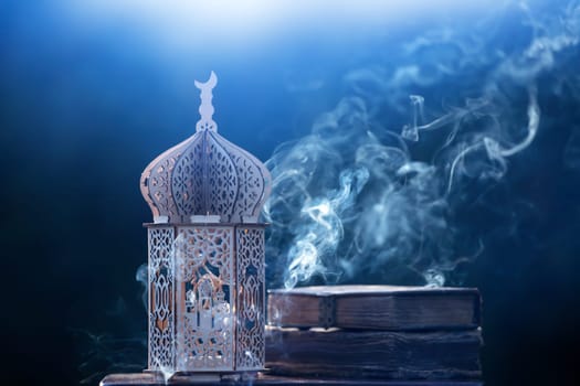 Ornamental Arabic lantern with with Holy Quran. Festive greeting card for Muslim holy month Ramadan Kareem.