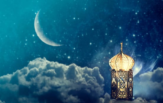 Ornamental Arabic lantern with crescent moon glowing at night. Festive greeting card for Muslim holy month Ramadan Kareem.