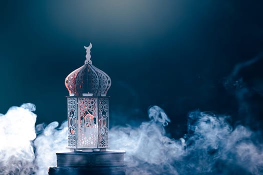 Ornamental Arabic lantern with with Holy Quran. Festive greeting card for Muslim holy month Ramadan Kareem.