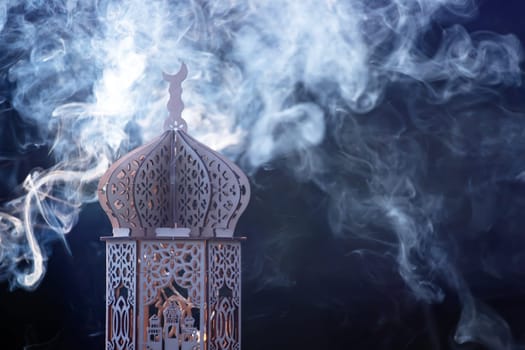 Ornamental Arabic lantern with smoke. Festive greeting card for Muslim holy month Ramadan Kareem.