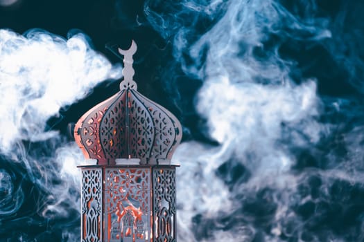 Ornamental Arabic lantern with smoke. Festive greeting card for Muslim holy month Ramadan Kareem.