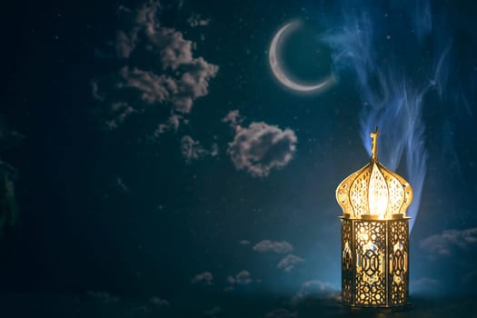 Ornamental Arabic lantern with crescent moon glowing at night. Festive greeting card for Muslim holy month Ramadan Kareem.