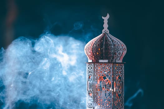 Ornamental Arabic lantern with smoke. Festive greeting card for Muslim holy month Ramadan Kareem.