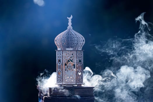 Ornamental Arabic lantern with with Holy Quran. Festive greeting card for Muslim holy month Ramadan Kareem.