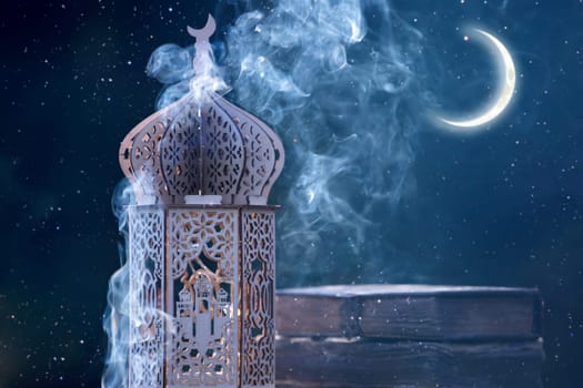 Arabic lantern with with Holy Quran and crescent moon. Festive greeting card for Muslim holy month Ramadan Kareem.