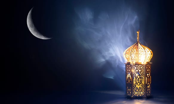 Ornamental Arabic lantern with crescent moon glowing at night. Festive greeting card for Muslim holy month Ramadan Kareem.
