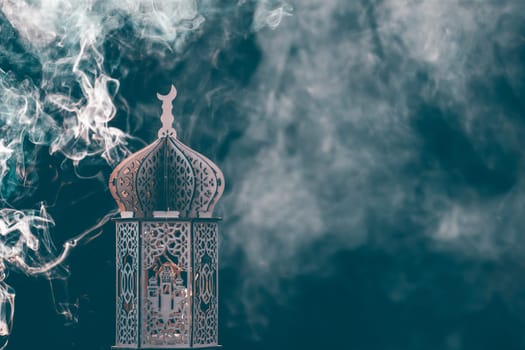 Ornamental Arabic lantern with smoke. Festive greeting card for Muslim holy month Ramadan Kareem.