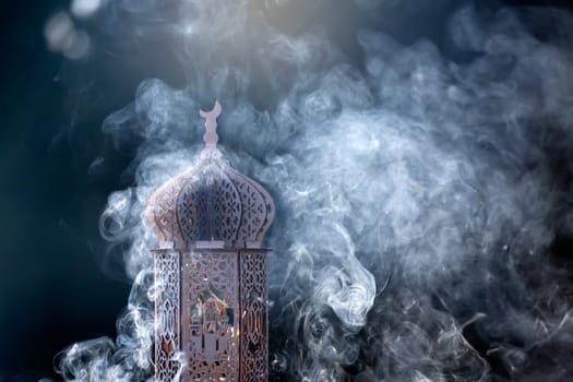 Ornamental Arabic lantern with smoke. Festive greeting card for Muslim holy month Ramadan Kareem.