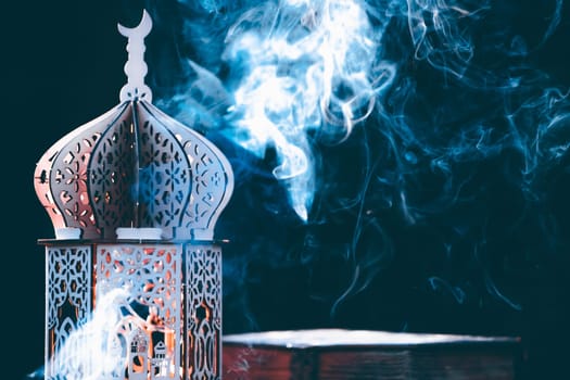 Ornamental Arabic lantern with with Holy Quran. Festive greeting card for Muslim holy month Ramadan Kareem.
