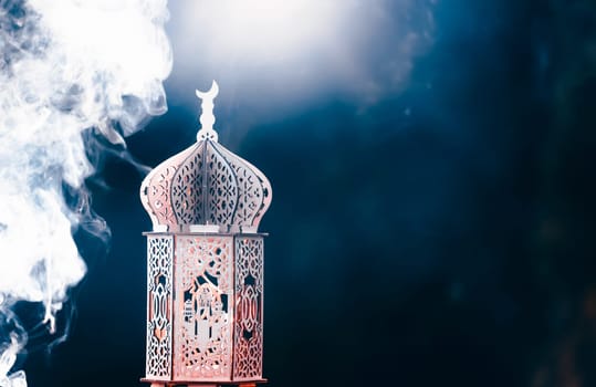 Ornamental Arabic lantern with smoke. Festive greeting card for Muslim holy month Ramadan Kareem.
