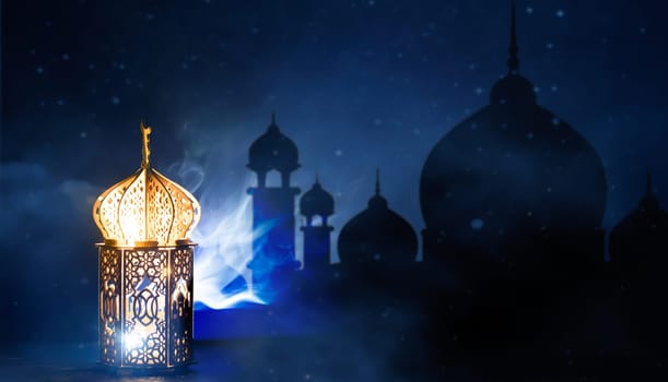 Ornamental Arabic lantern with crescent moon glowing at night. Festive greeting card for Muslim holy month Ramadan Kareem.