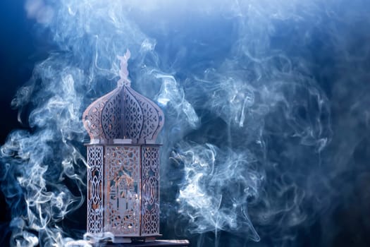 Ornamental Arabic lantern with smoke. Festive greeting card for Muslim holy month Ramadan Kareem.