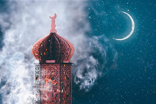 Ornamental Arabic lantern with crescent moon glowing at night. Festive greeting card for Muslim holy month Ramadan Kareem.