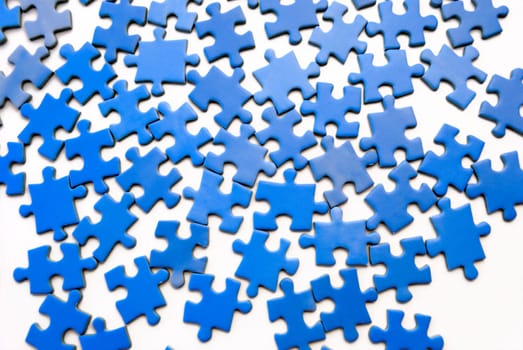 Blue puzzle over white background