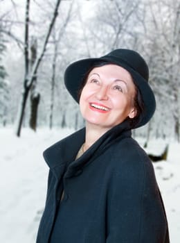 Happy elderly woman enjoy the winter