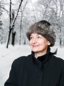 Happy elderly woman enjoy the winter