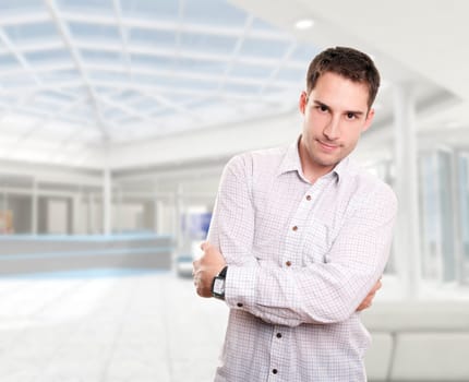 Young attractive businessman isolated over white
