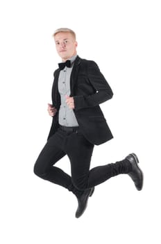 Young caucasian man jumping in the air , isolated on white