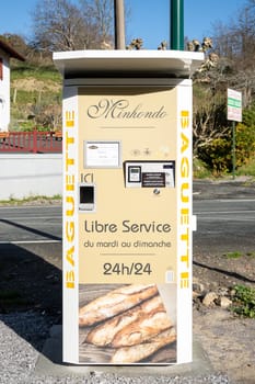 SUHESCUN, FRANCE - CIRCA DECEMBER 2020: Minhondo Bakery baguette vending machine.