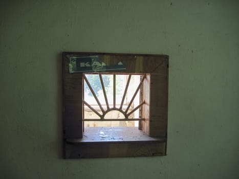 The window of issuing money at the cash register. Abandoned building. Soviet ruins.