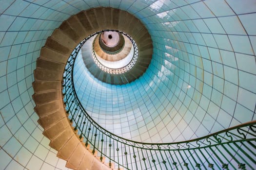 View of high lighthouse blue staircase,  vierge island, brittany,france