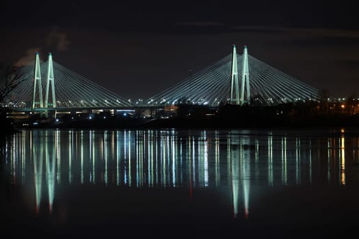Big cable-stayed bridge of St. Petersburg illuminated at night