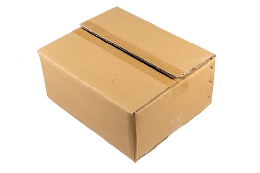 Side view of a closed cardboard box isolated on white