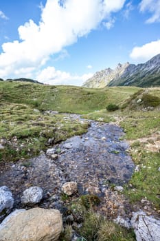 Idyllic little streamlet in the alps, mountain landscape