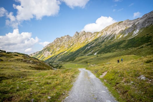 Hiking trail in the Austrian mountains, mountain range and blue sky