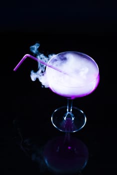 photo of a colored drink with smoke