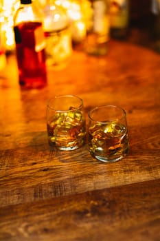 Whiskey drinks on wood in bar