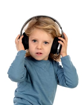 Happy blond child with headphones an blue t-shirt isolated on a white background