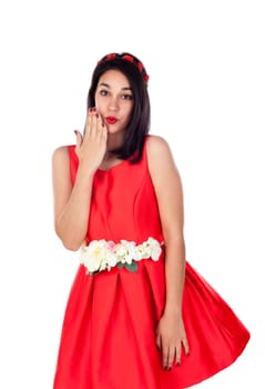 Shy brunette girl with a elegant red cocktail dress isolated on a white background