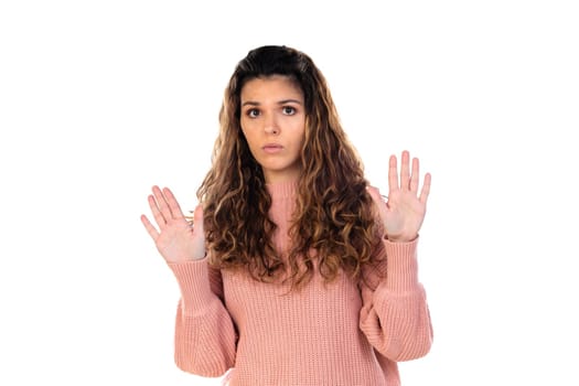 Beautiful middle aged woman with pink woolen sweater isolated on a white background