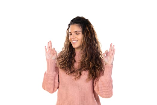 Beautiful middle aged woman with pink woolen sweater isolated on a white background