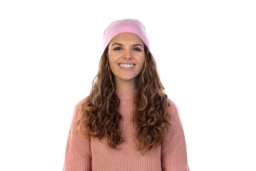 Hopeful woman with cancer wearing a thoughtful pink scarf isolated on a white background
