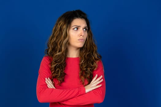 Portrait of beautiful caucasian girl with curly hair isolated on a white background