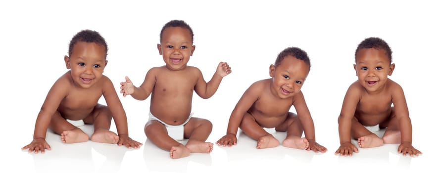 Four funny african baby sitting on the floor isolated on white background