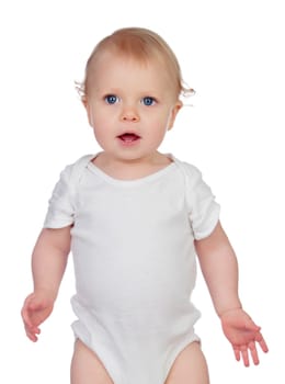 Small baby with a blue eyes and blond hair standing while look at camera