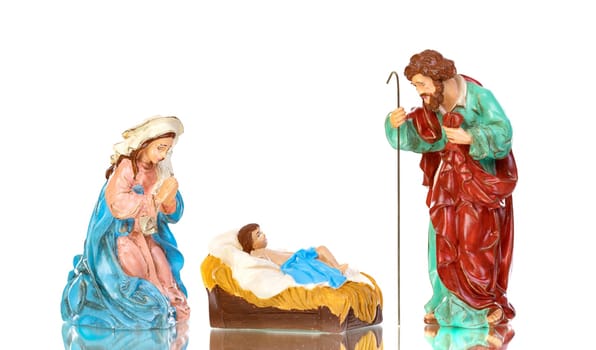 Traditional Christmas nativity with Mary and Joseph and Baby Jesus isolated on a white background