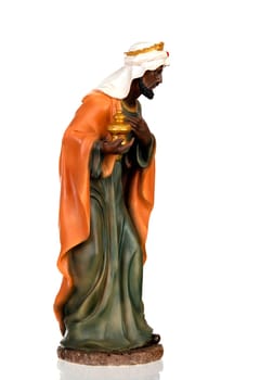 Baltasar, one of the three wise men. Ceramic figure isolated on white background