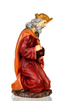 Melchor, one of the three wise men. Ceramic figure isolated on white background