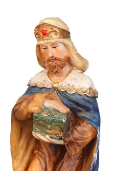 Melchor, one of the three wise men. Ceramic figure isolated on white background
