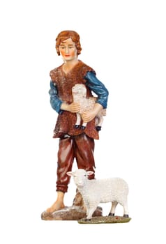 Figure of the shepherd with a sheep for the nativity portal isolated on a white background