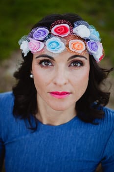 Pretty brunette girl with flower crown in the park