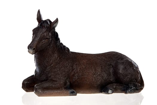 Figure of a mule for the Nativity Potal isolated on a white background