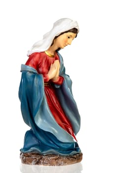 Ceramic figure of the virgin mary isolated on white background