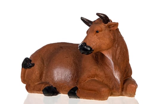 Figure of a big ox for the Nativity Potal isolated on a white background
